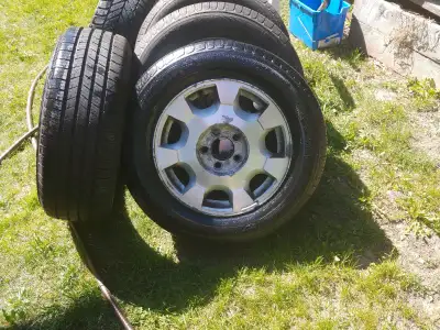 4 Micheline Defender all Season tires, 3 are on Aluminum Alloy Rims. Size: 225 - 60 - R16, under 2,0...