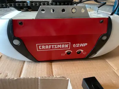 Craftsman 1/2 HP chain garage door opener. All wiring and remotes included. In good condition no iss...