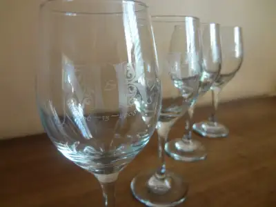 Custom etched or engraved glasses, perfect for use as wedding/reception favours, commemoriative even...