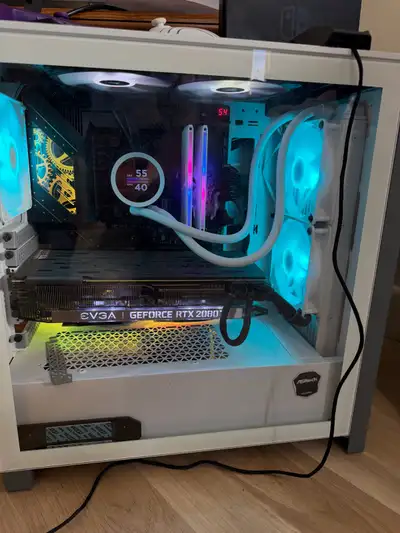 Powerful gaming PC. White case with RGB lighting. Has AMD Ryzen 9 9900X 12-Core processor, 48 GB of...
