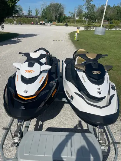 Very good condition pair of Seadoo’s 2012 260 RXT is and 2012 155 GTX is double aluminum trailer. 26...