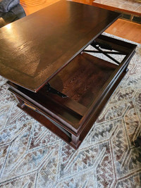 Coffee table top lifts up