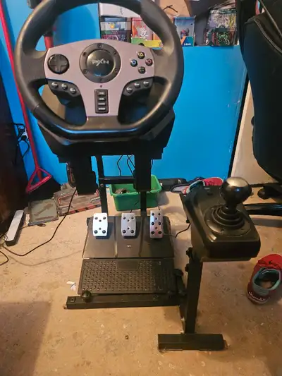 Pxn v9 steering with pedals gearshifter and stand works great just dont get around to using it anymo...