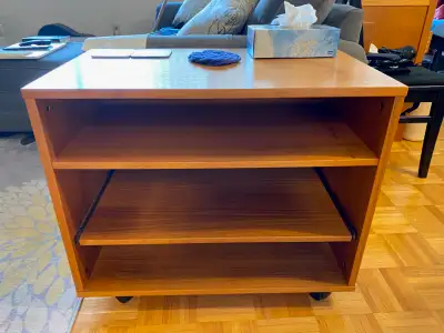 Small teak-veneer TV stand on casters, View more