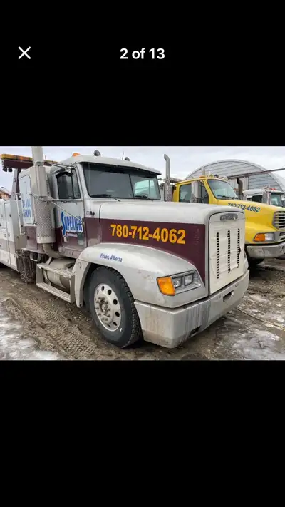 1994 Freightliner with a solid N14 motor. 18 speed, 46k locking rear ends. NRC 30 Ton Wrecker with d...