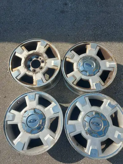 17" 6 bolt rims from Ford F-150. Not great condition, but not bent or damaged. 3 center caps only.