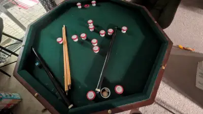 The top of the table has a few scratches. The inside parts; the pool table and the poker table are i...