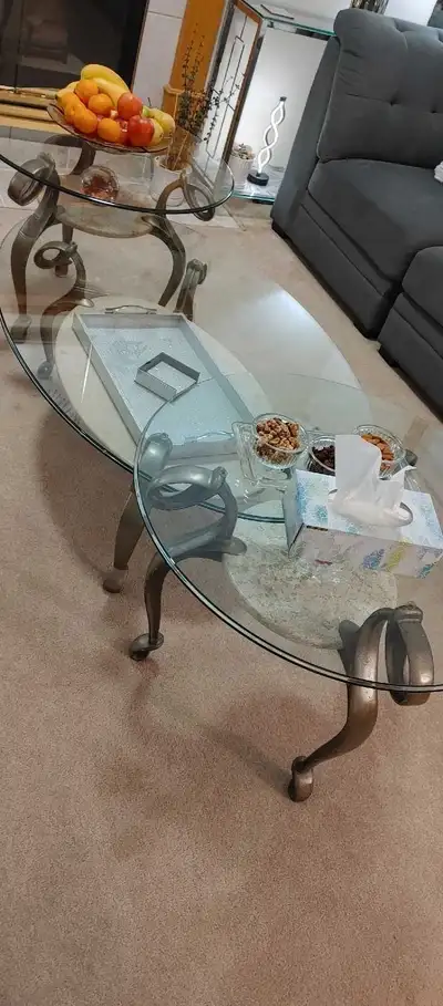 Selling 1 coffee table and 4 end tables with a glass top and a lower shelf made of marble. It's got...