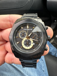 Black and gold Michael hill watch 
