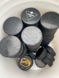 100 used hockey pucks for sale