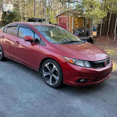 Thinking of selling my 2012 Honda Civic Si The car has just over 245,000km and runs and drives great...