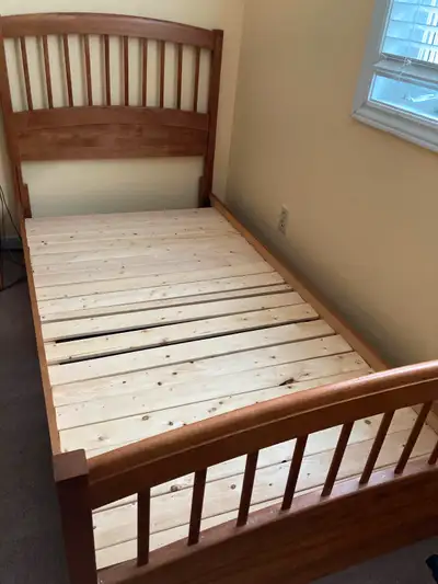 twin bed frame. made from real wood. pretty and smooth finish. pick up in Orleans. it will be disman...