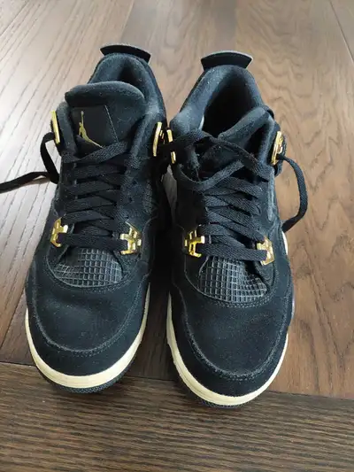 fairly new black and gold Jordan 4s, View more