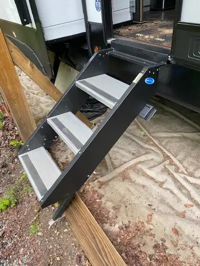 I have a solid staircase for a trailer or 5th wheel with a 26-28 in door opening and a threshold hei...