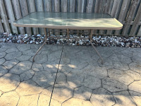 Patio table, tempered glass top Size is 37 inches by 61 inches