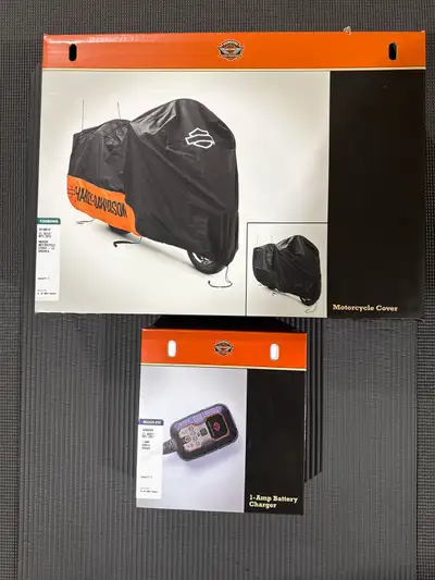 Brand new never used sold my bike. Cover is large P/N 93100018 price is $100. Charger is 1 amp P/N 6...