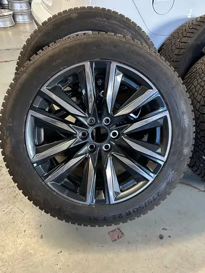 Used 22” OEM Cadillac Escalade sport wheels with OEM tire pressure sensors and continental winter ti...