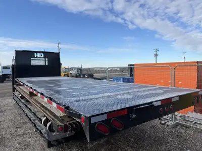 Brand new 20’ steel flat deck, 16” on centre floor cross members, diamond plate decking, headache ra...
