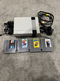 Nes with 2 controllers and 4 games 