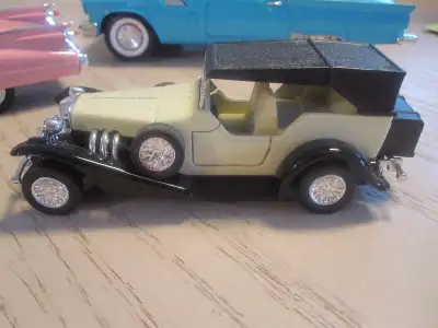 Beige car, all doors open $15 Model cars 1/24 1957 Ford thunderbird, blue, $25 SOLD 1/34 1959 Pink c...