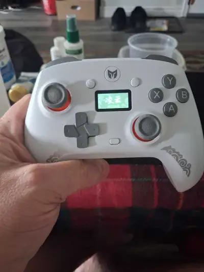Sleek white wireless game controller. Has a cool design and back paddles for extra customization. Bl...