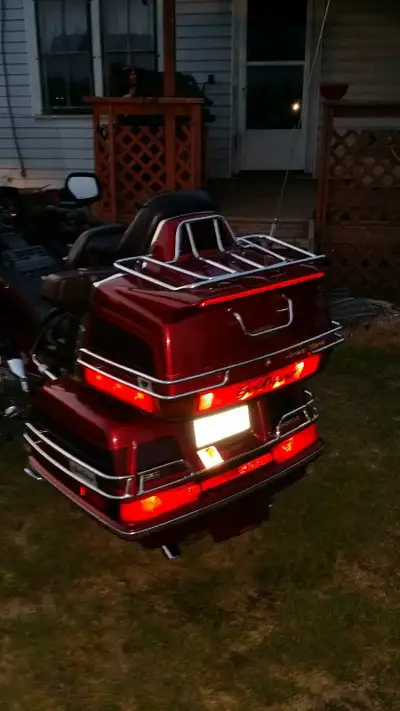 Feast your eyes on this burgundy beauty, a used Goldwing motorcycle, perfect for long rides and turn...