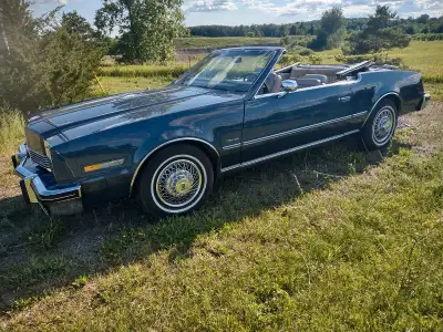 A beautiful convertible. The miles are US, not kms. Rides great. The AC does not work.