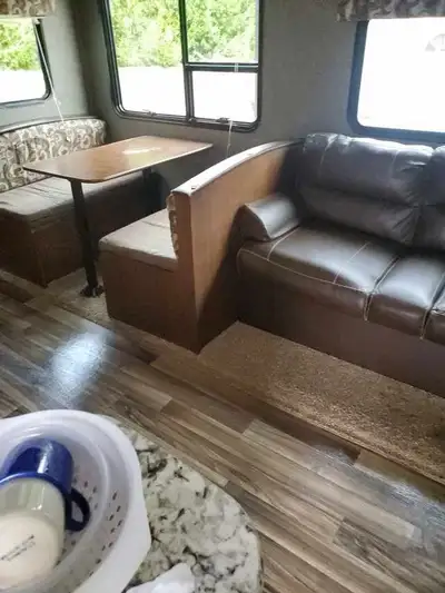 Keystone 2017 camper has bunk beds table turns into a bed couch into a bed and queen in the back. Tv...