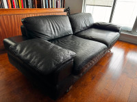 Italian black leather sofa in fair condition.