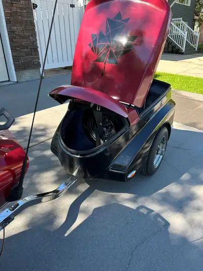 Motorcycle pull behind Trekker trailer (Canadian made). Chrome wheels, grease buddies, spare tire wi...
