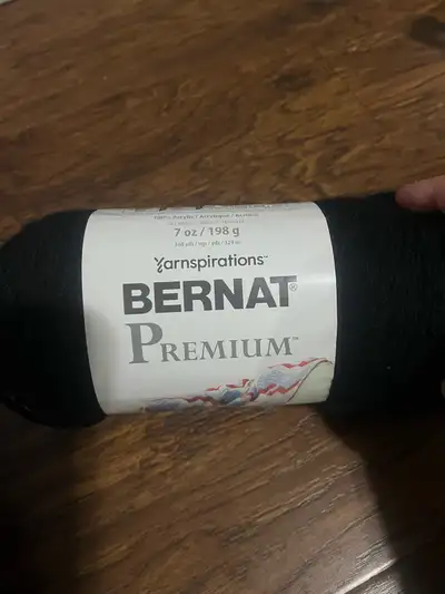 This is a skein of Bernat Premium yarn, perfect for your knitting and crochet projects. It is in new...