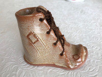 Vintage ceramic shoe featuring laces signed “Pero”