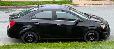 Black 2012 Chevrolet Sonic 4-door sedan with 300,000 km. MVI is valid until January 2027. Recent mai...
