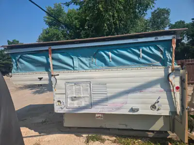 Pop up slide in camper fully insulated solid galvanized steel roof does not lead at all Was gutted f...