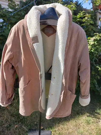 NEW, long suede jacket, size lg. Rundle, NE close to Sunridge Mall.