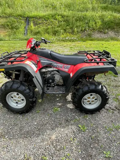 Artic Cat 400 /blade 4 wheel drive Tires like new Not used in the bush, only snow removal Winch Rack...