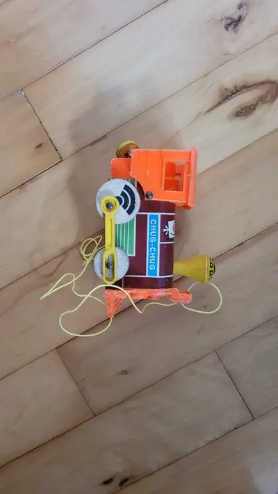Vintage Fisher-Price "Chug-Chug" train pull toy from the 1970s. Classic collectible pull-along toy F...