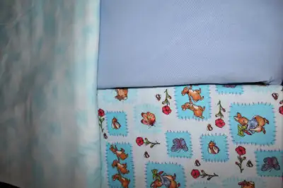 SERGER BOOK $10 PRINTED FLANNELETTE... $4 / YD. BLUE COTTON / POLY $4/ YD. QUILT PAPER PIECING BOOK....