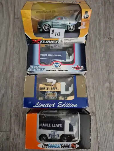 Collection of three die-cast vehicles. Includes a Nissan Skyline GT-R model and two Toronto Maple Le...