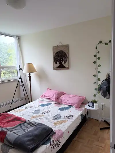 Room in sharing available only for a female - Available April 1st - Near Broadview, Pape and Donland...