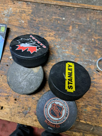 4 hockey pucks