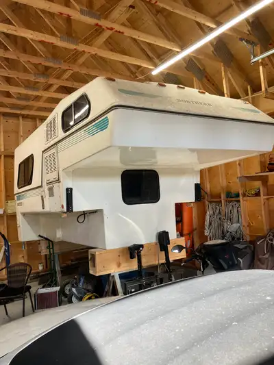 REDUCED $5000. Northern Light Slide in camper series 9.6 in good condition. This 1992 unit has been...