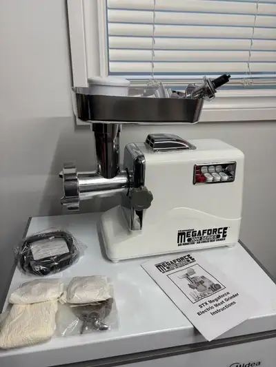 Megaforce 3000 meat grinder with burger press, foot switch and multiple plates. Paid $300.00, used l...