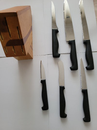 5 New knives+1 butter knife with wooden pedestalSet $25