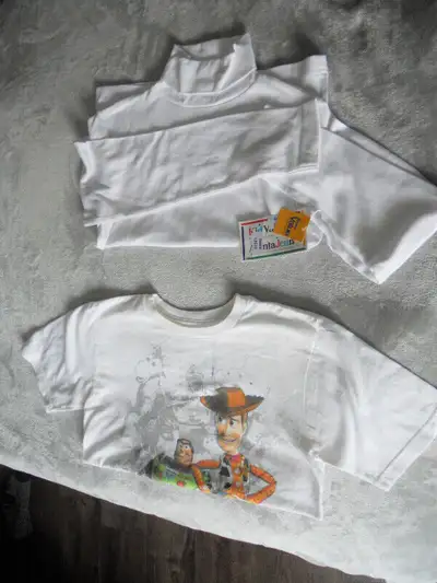 Girls' white short sleeve top. Size Large. Girls' white long sleeve turtleneck. Size Large. Never wo...