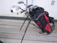 left hand golf clubs , and carry  bag and stand, balls, tees