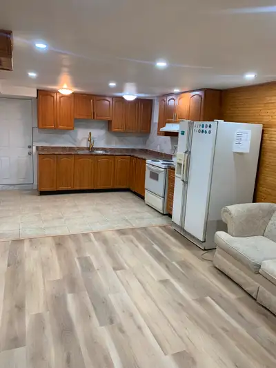 Spacious 2 bedroom basement apartment separate entrance and separate laundry Wooden floor led pot li...