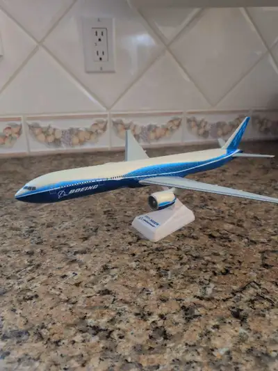 This is a used Boeing 777-300ER display model, perfect for aviation enthusiasts. It's a detailed rep...