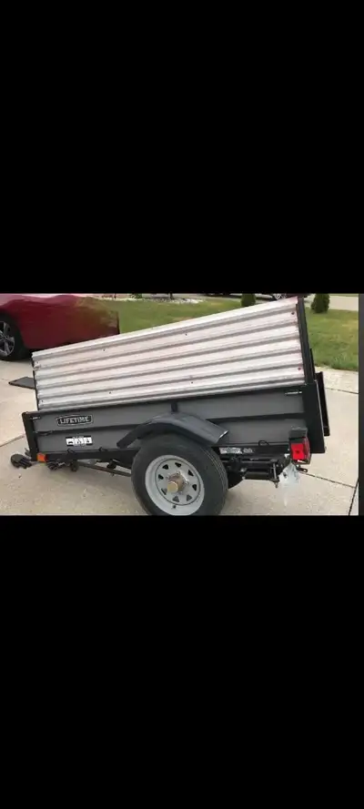 Lifetime brand folding 6x4 utility trailer. 29 inches wide when folded. Oil guarded. 2 inch ball, 10...