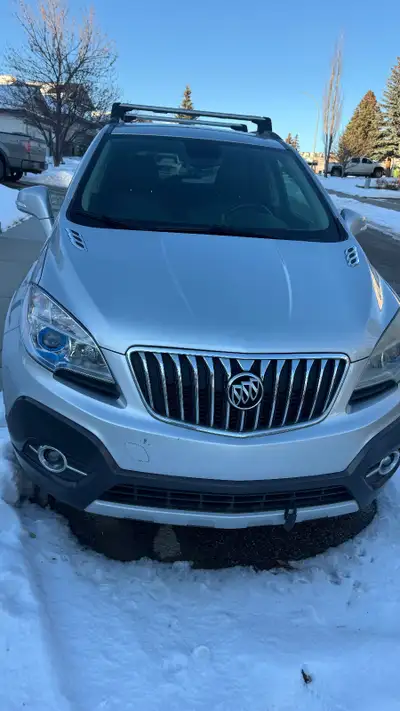 Will not respond to scammers. If Ad is up it is still available. 2014 Silver Buick Encore Premium AW...